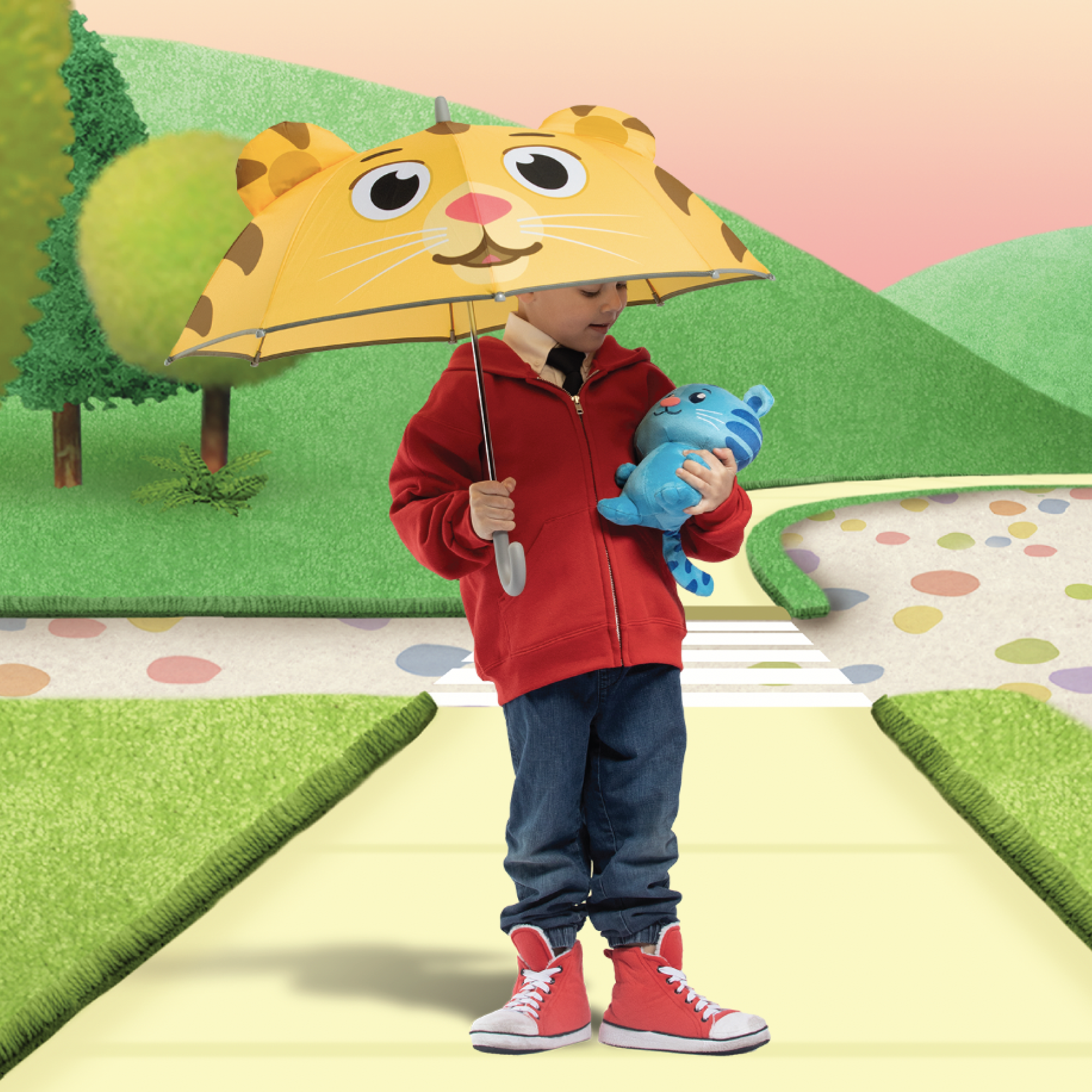 Boy holding Daniel Tiger's Neighborhood Kids Umbrella.