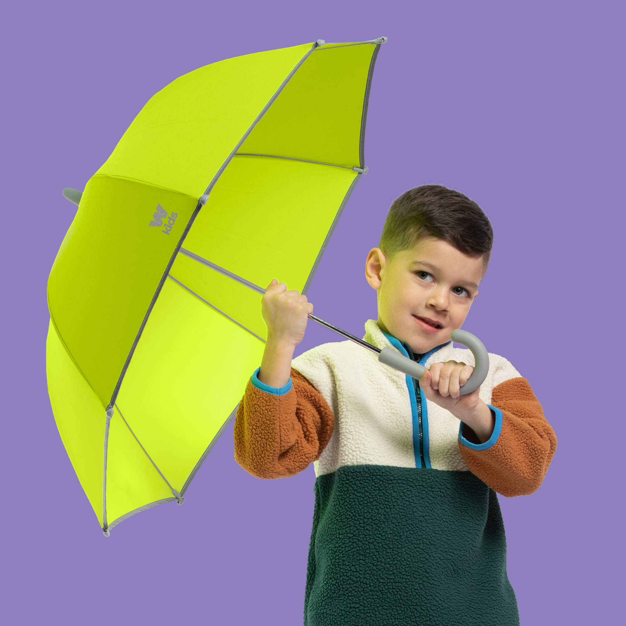 Boy holding Weatherman Kids Umbrella in neon yellow.