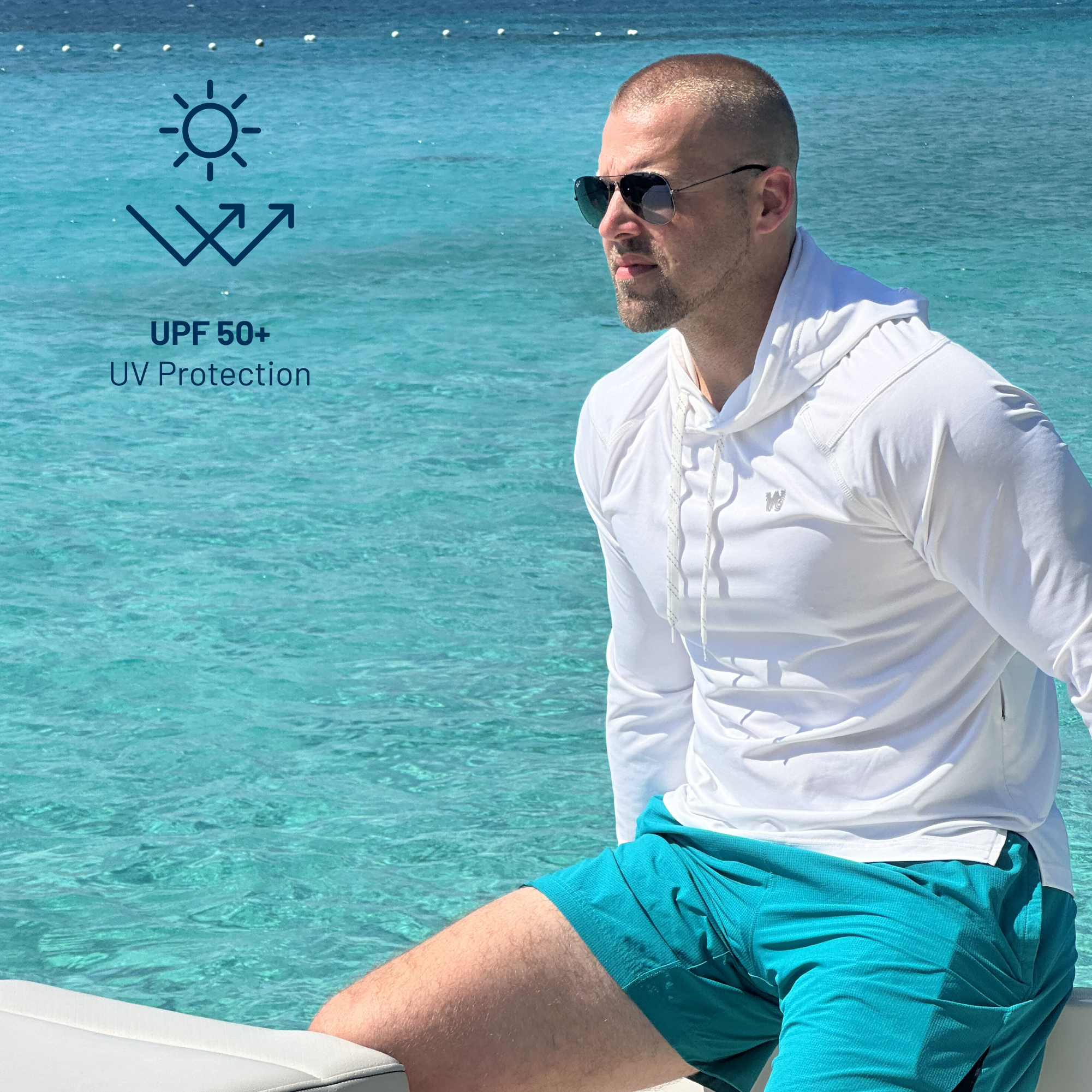 Man on a boat wearing Weatherman UPF 50+ UV Protection Sun Shirt in white.