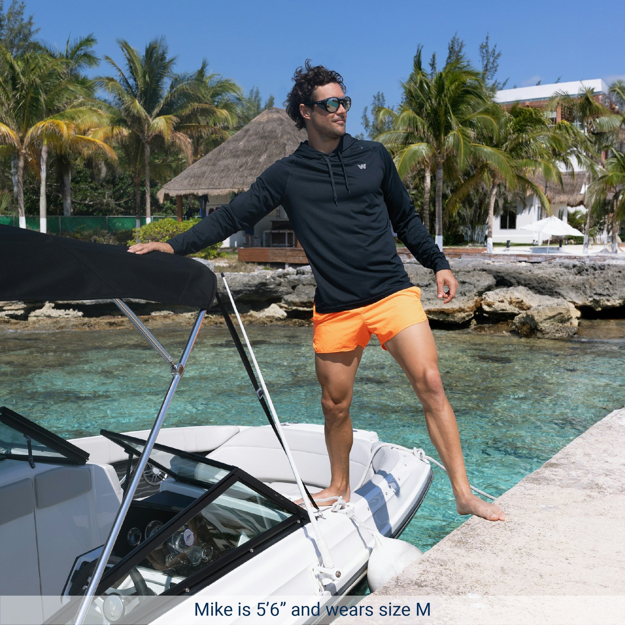 Man on a boat wearing Weatherman UPF 50+ UV Protection Sun Shirt in midnight blue.